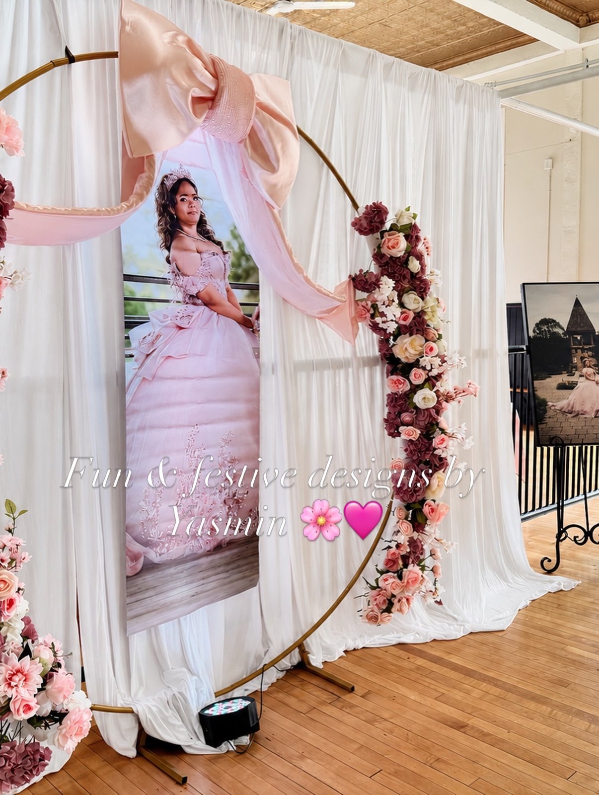 Personalized quinceañera welcome display with pink fabric and floral accents