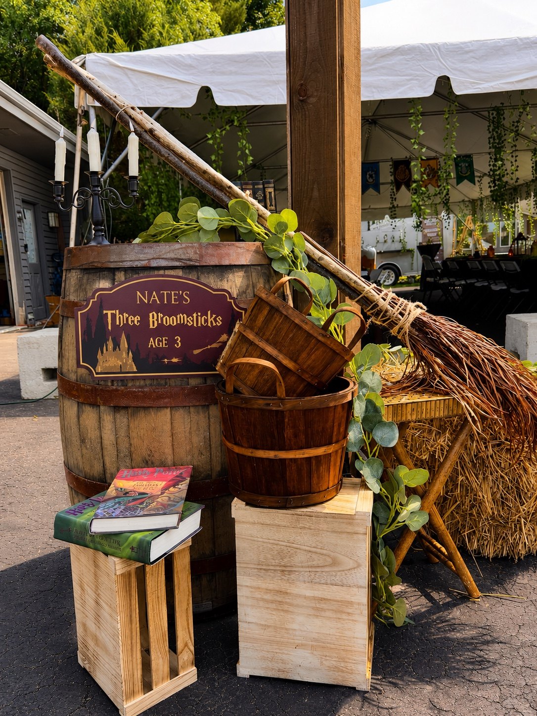 Rustic broomsticks, barrels and personalized signage for Nate’s birthday