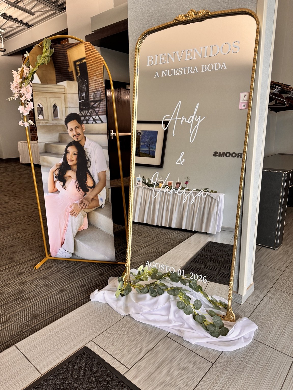 Personalized quinceañera welcome mirror with portrait display and white floral accents