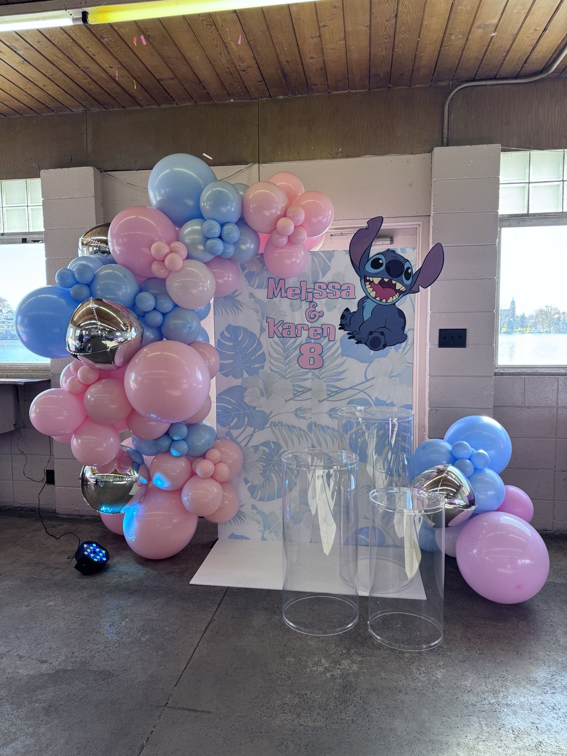 Stitch birthday celebration with pink and blue balloons and a personalized Stitch theme