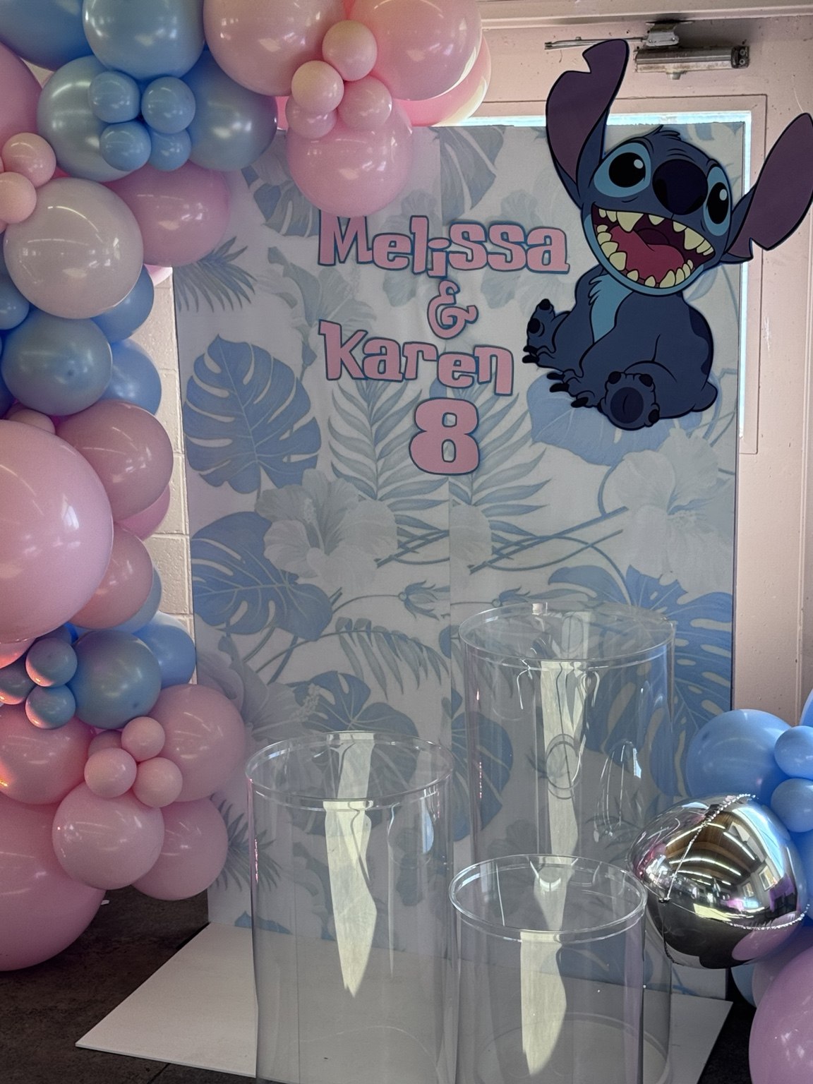 A playful Stitch celebration with pink and blue balloons and a personalized Stitch theme