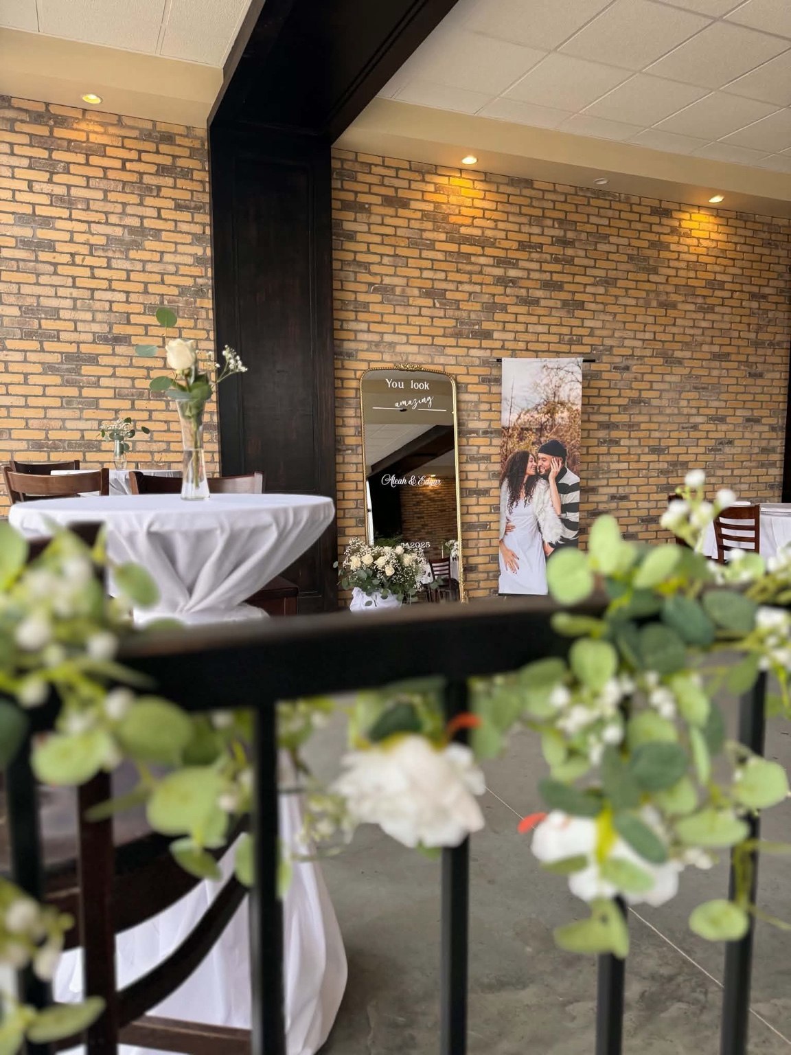 White flowers and greenery at an elegant wedding reception